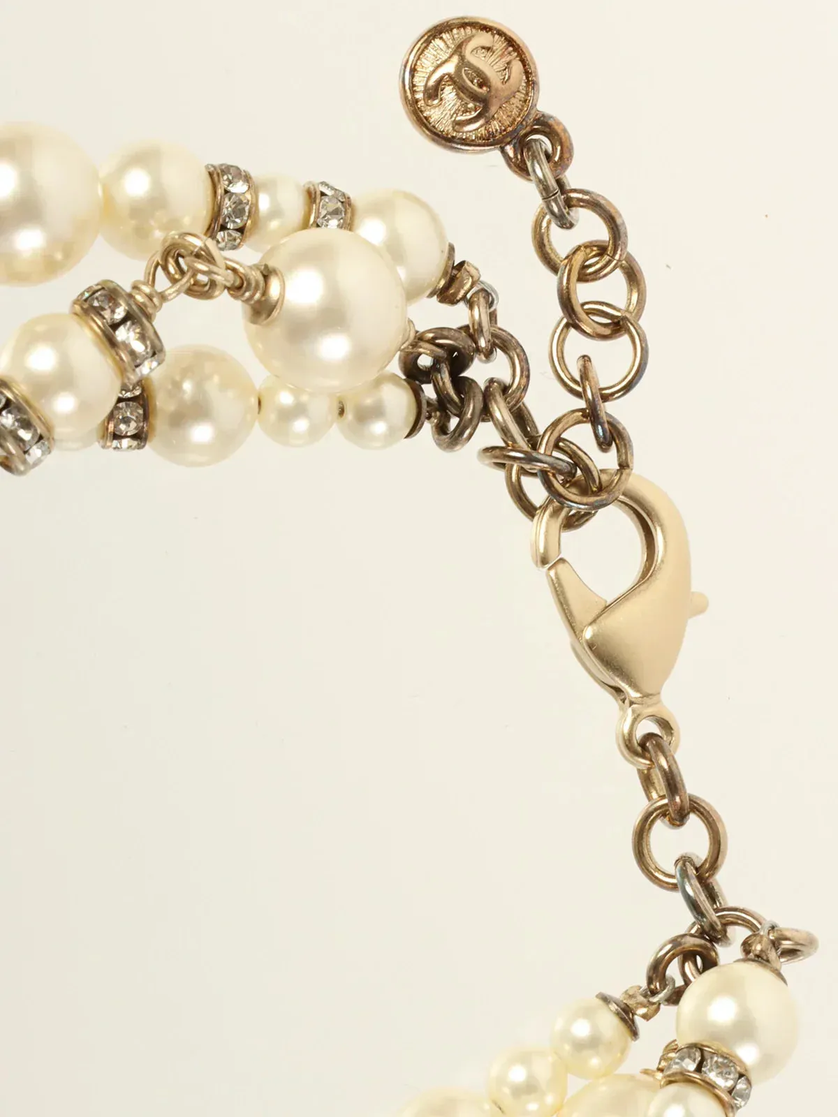 CHANEL 2013 Made Pearl Rhinestone Ribbon Motif Bracelet Gold/White