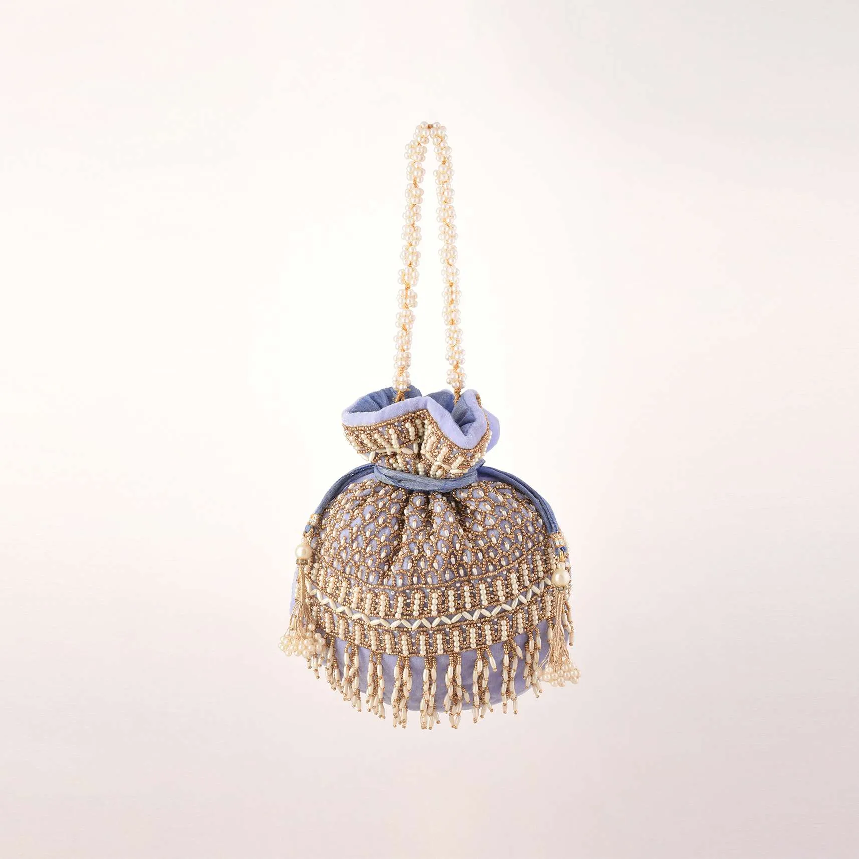 Lavender Potli In Velvet Heavily Embroidered With Beads And Moti Work In Scalloped And Tassel